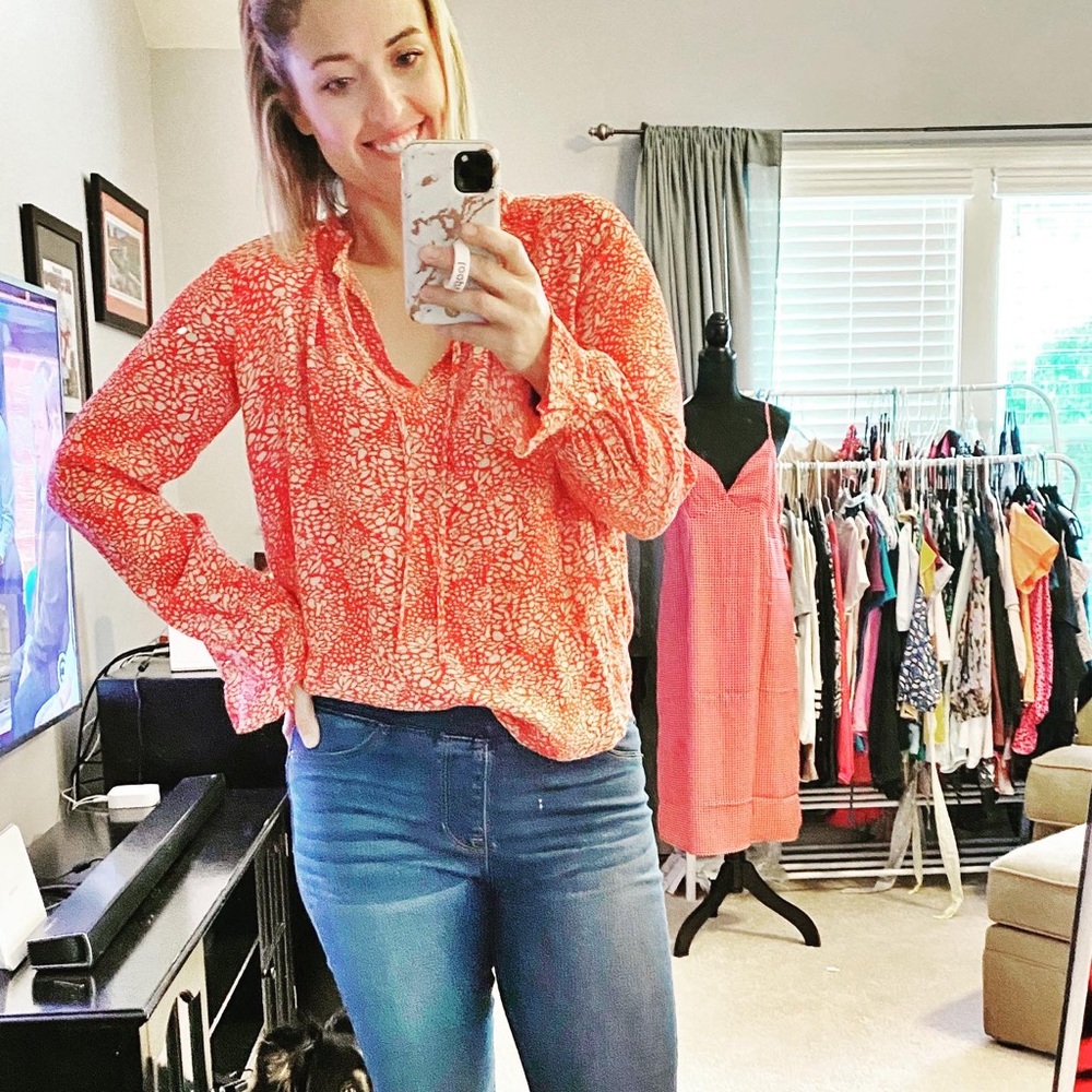 Red and beige patterned blouse
